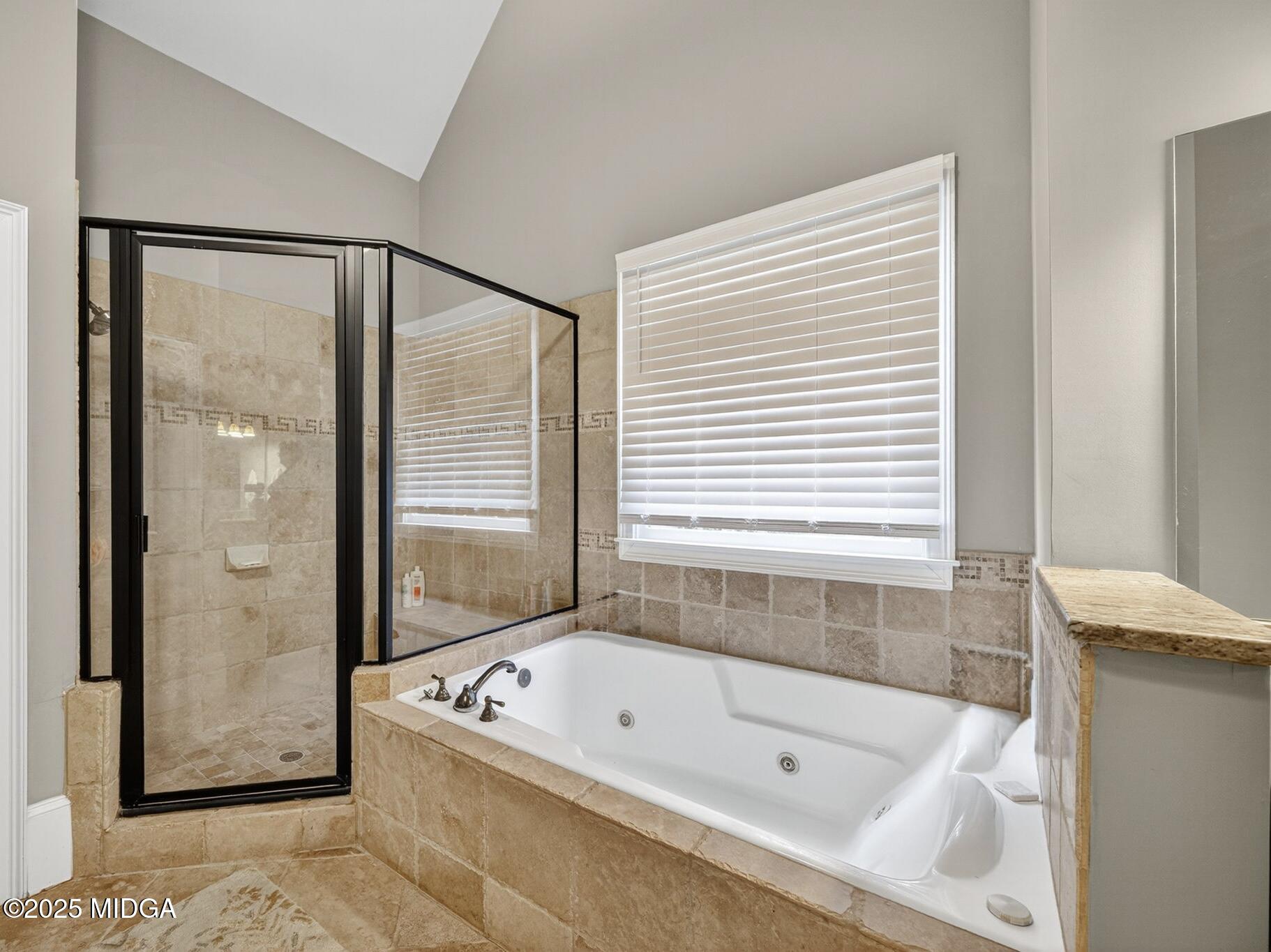 120 Homestead Circle Forsyth, GA 31029 - Photo 21 of 68 a bathroom with a tub a shower and a sink