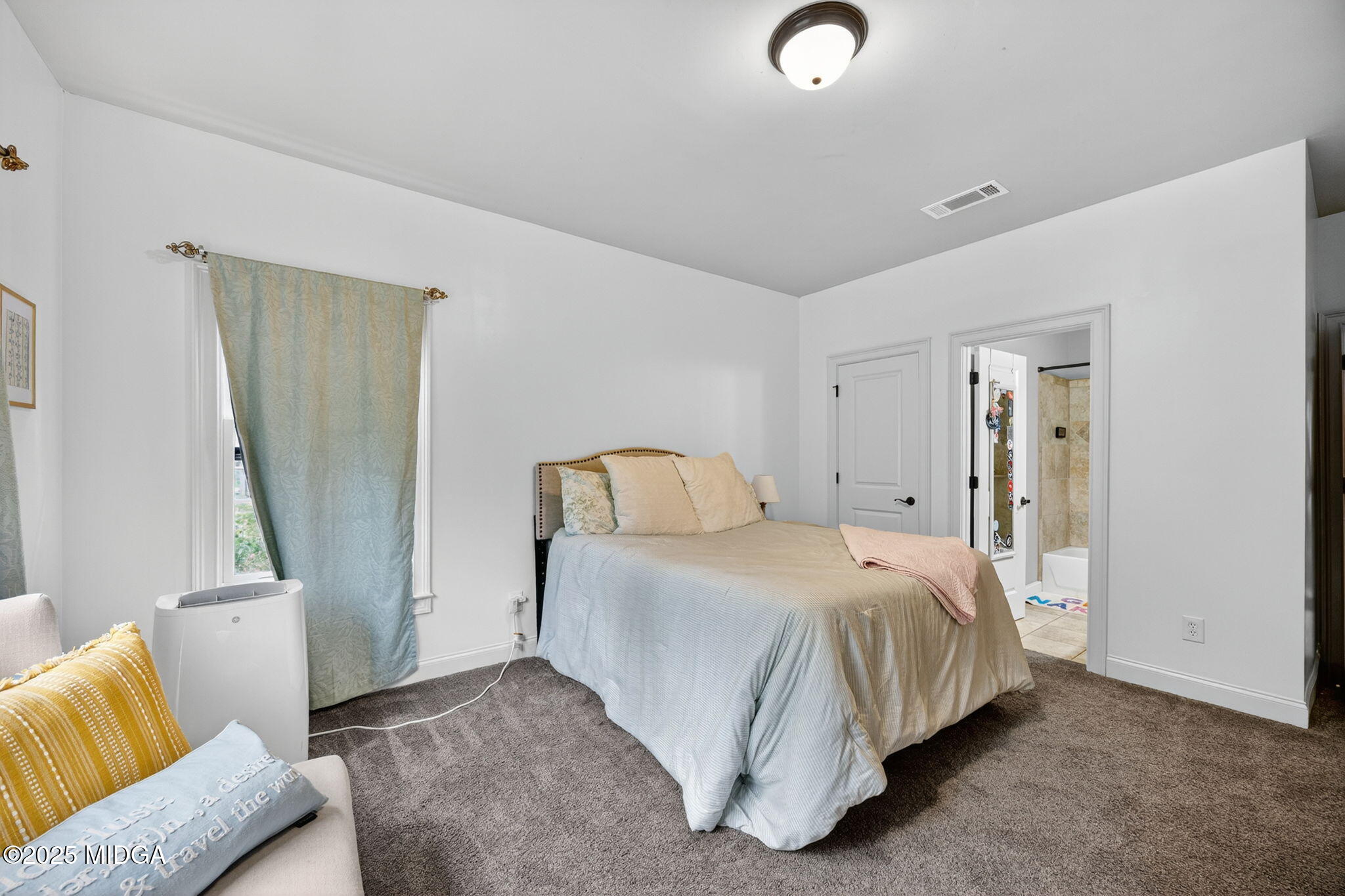 120 Homestead Circle Forsyth, GA 31029 - Photo 24 of 68 a bed room with a bed and a couch