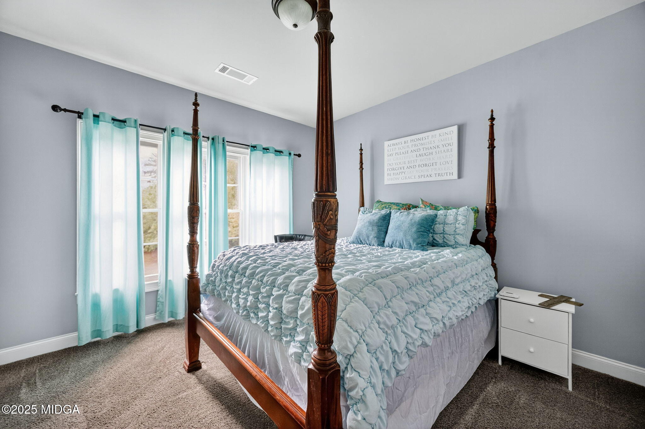 120 Homestead Circle Forsyth, GA 31029 - Photo 26 of 68 a bedroom with a bed and a dresser