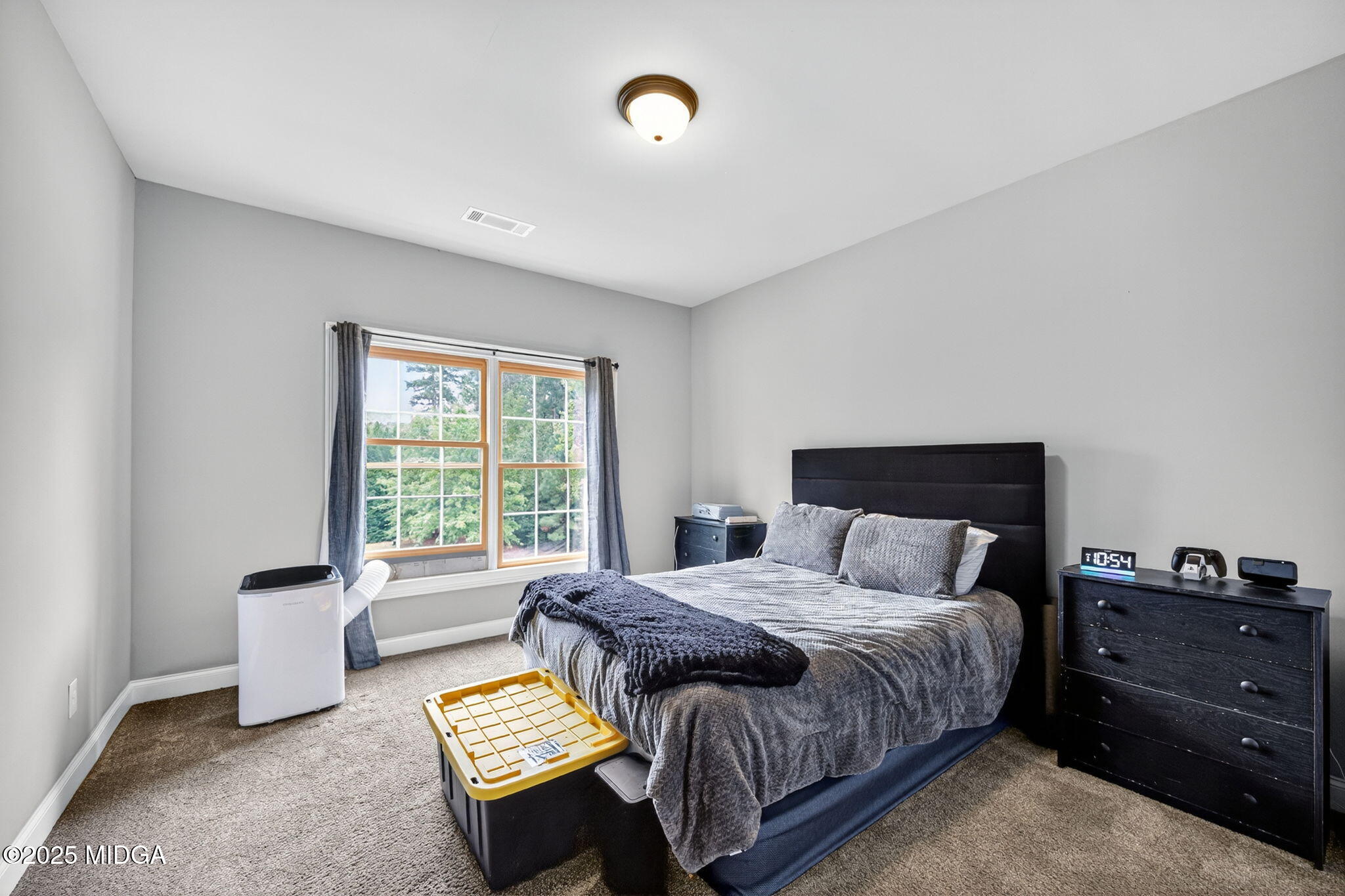 120 Homestead Circle Forsyth, GA 31029 - Photo 29 of 68 a bedroom with a bed and a window