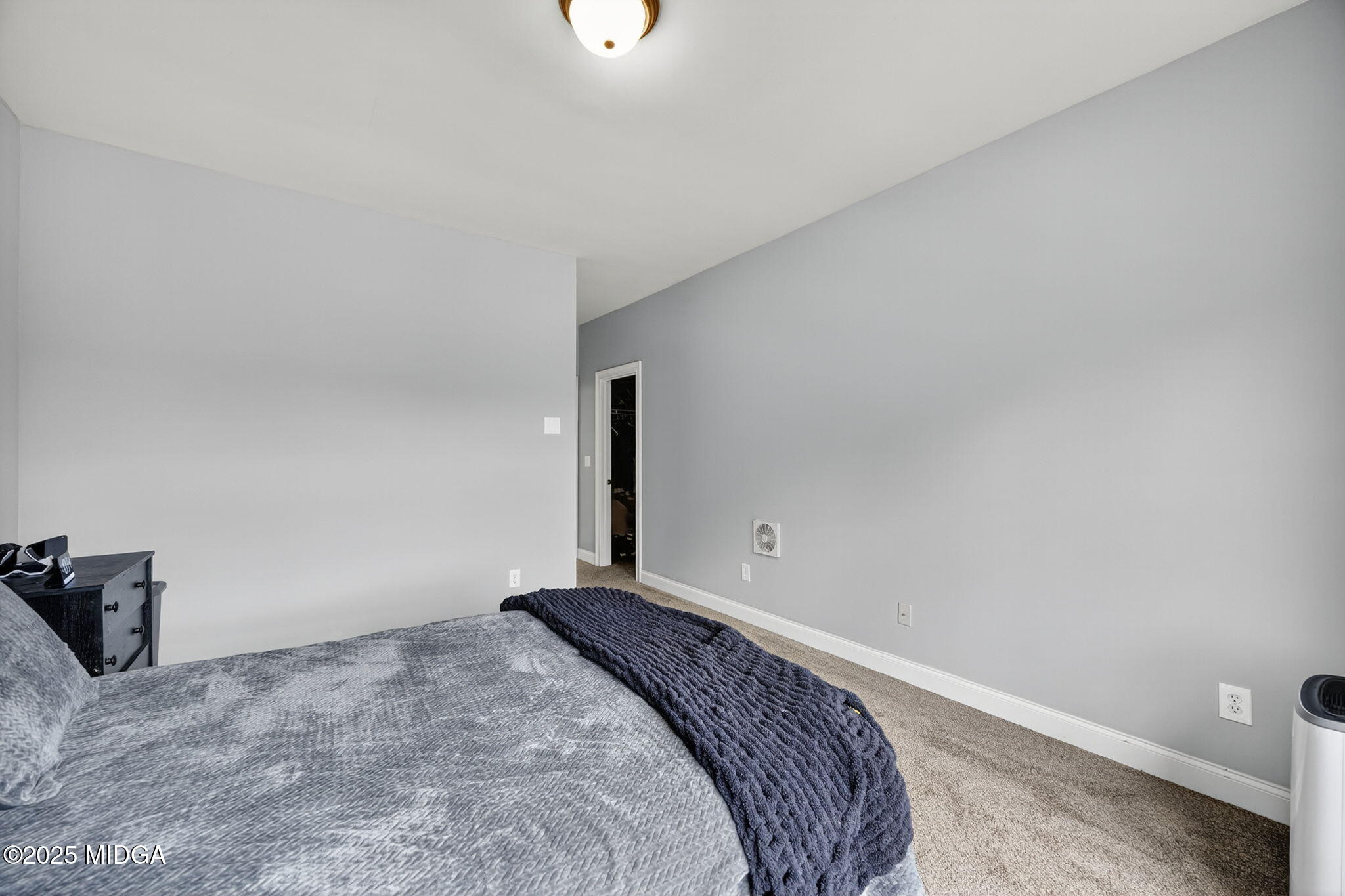 120 Homestead Circle Forsyth, GA 31029 - Photo 30 of 68 a bedroom with a bed and a window