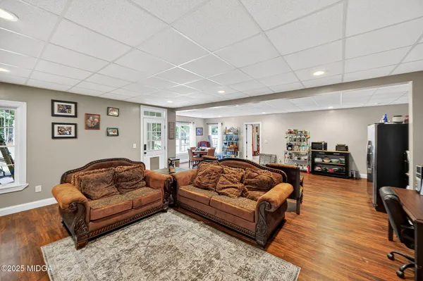 a view of a house with a yard and sitting area