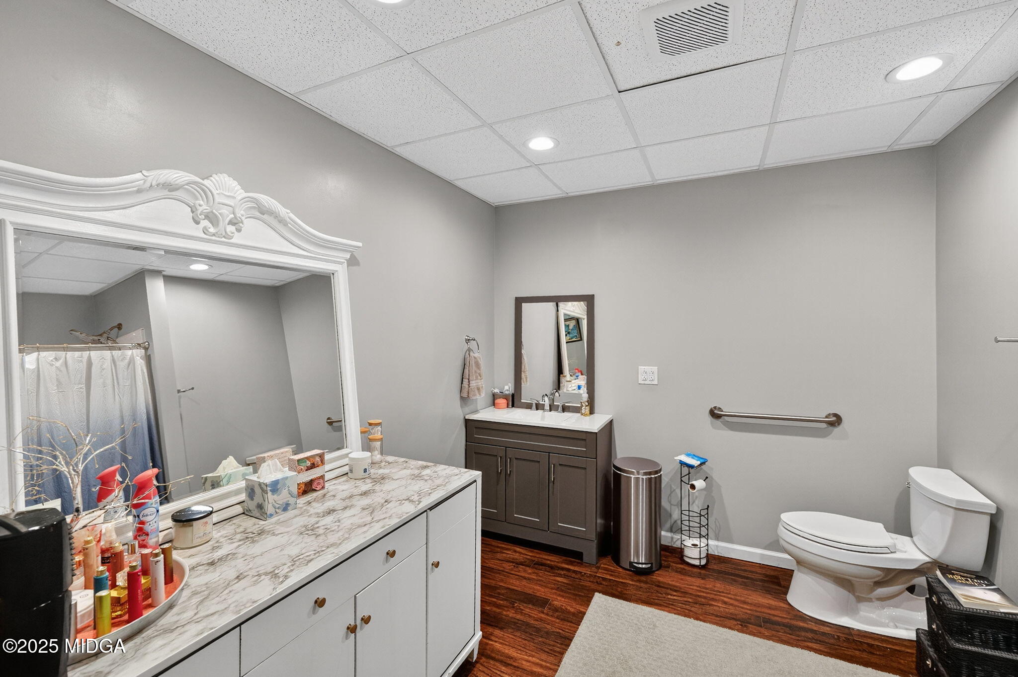 120 Homestead Circle Forsyth, GA 31029 - Photo 38 of 68 a bathroom with a sink a toilet and mirror