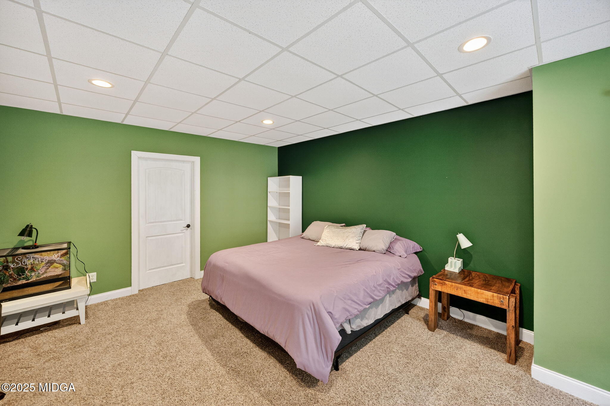 120 Homestead Circle Forsyth, GA 31029 - Photo 39 of 68 a bedroom with a bed and a wall painting