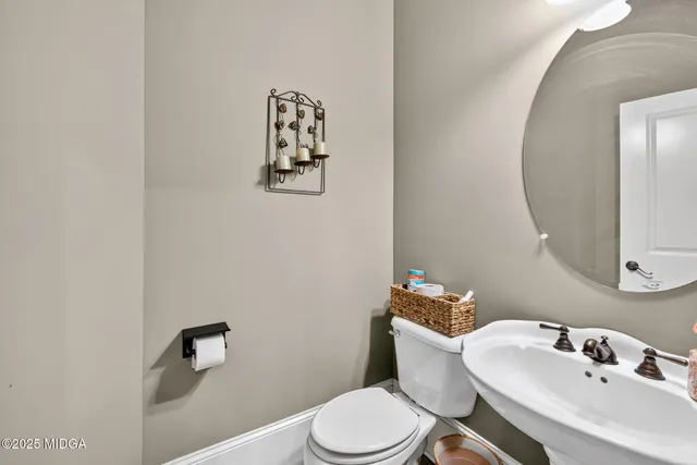 an aerial view of a house with a garden and trees