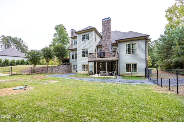 an aerial view of a house with a garden
