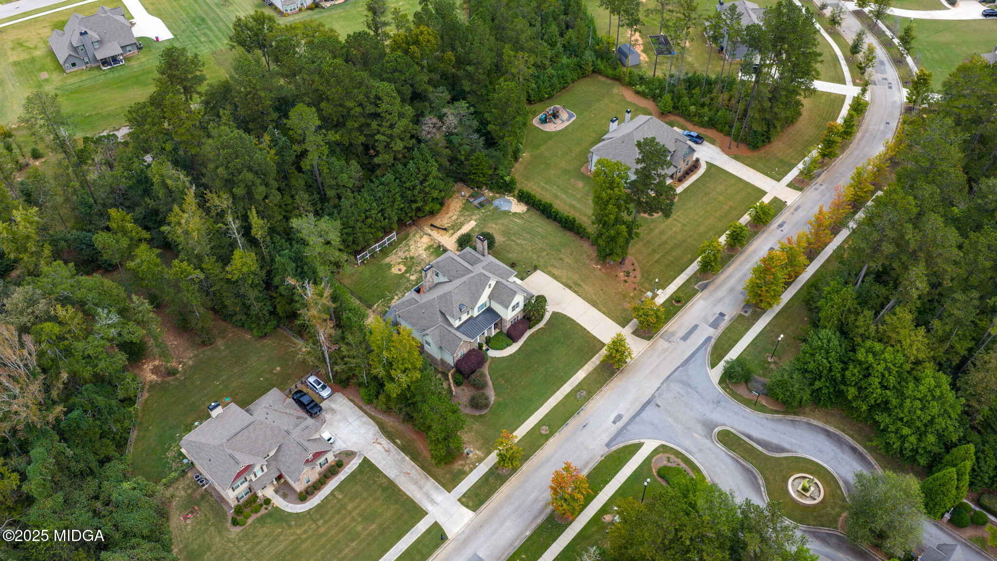 120 Homestead Circle Forsyth, GA 31029 - Photo 56 of 68 an aerial view of a house with a garden and trees