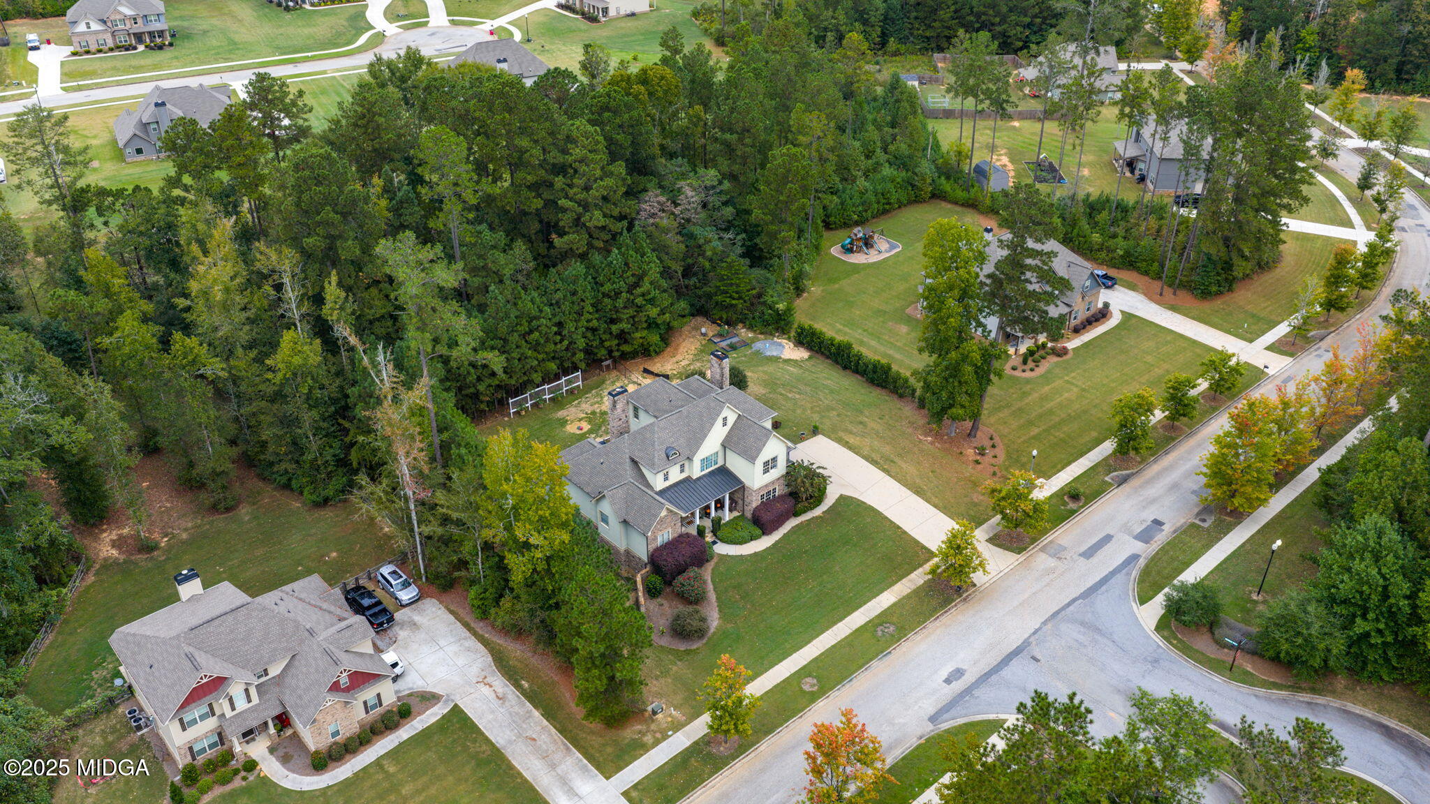 120 Homestead Circle Forsyth, GA 31029 - Photo 58 of 68 an aerial view of a house with outdoor space and a lake view