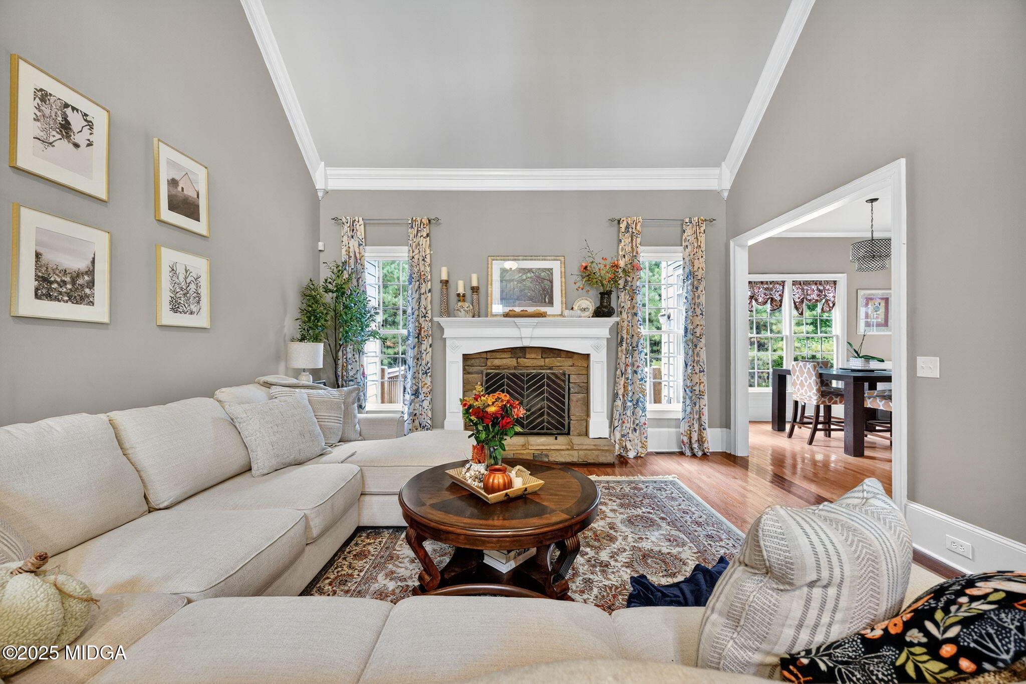120 Homestead Circle Forsyth, GA 31029 - Photo 6 of 68 a living room with furniture and a fireplace