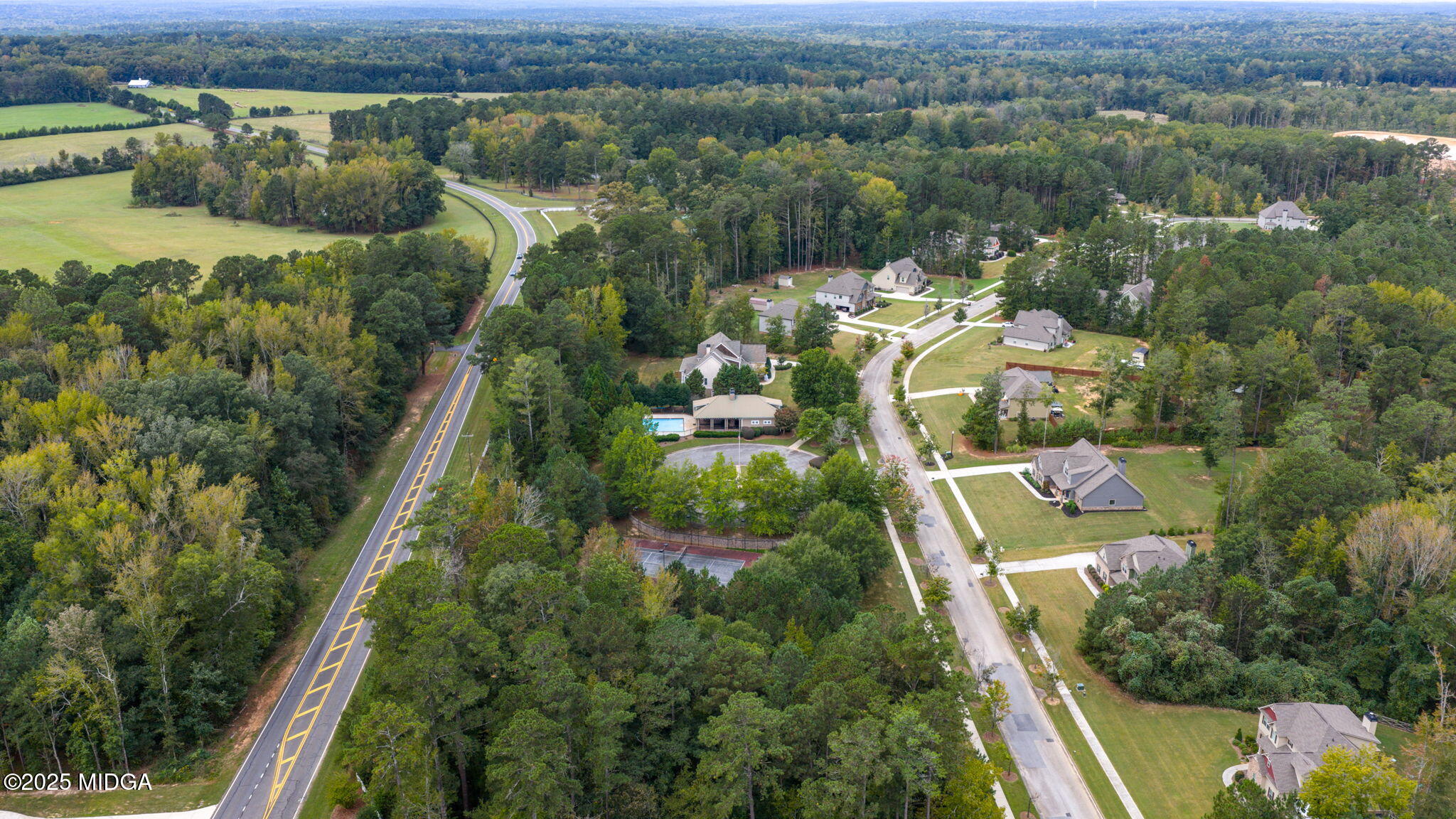 120 Homestead Circle Forsyth, GA 31029 - Photo 64 of 68 an aerial view of residential houses with outdoor space and trees