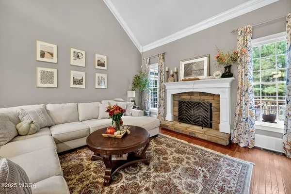 a view of a dining room with furniture wooden floor and chandelier