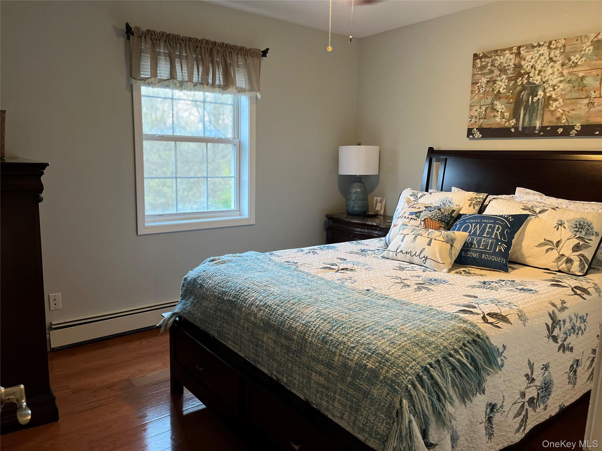 124 Rutsonville Road Wallkill, NY 12589 - Photo 19 of 33 Hardwood flooring and ceiling fan.
