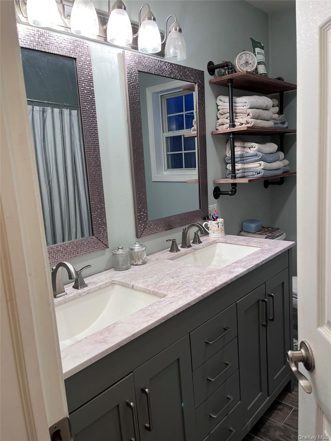 124 Rutsonville Road Wallkill, NY 12589 - Photo 24 of 33 Primary Bathroom with double sinks and linen closet.