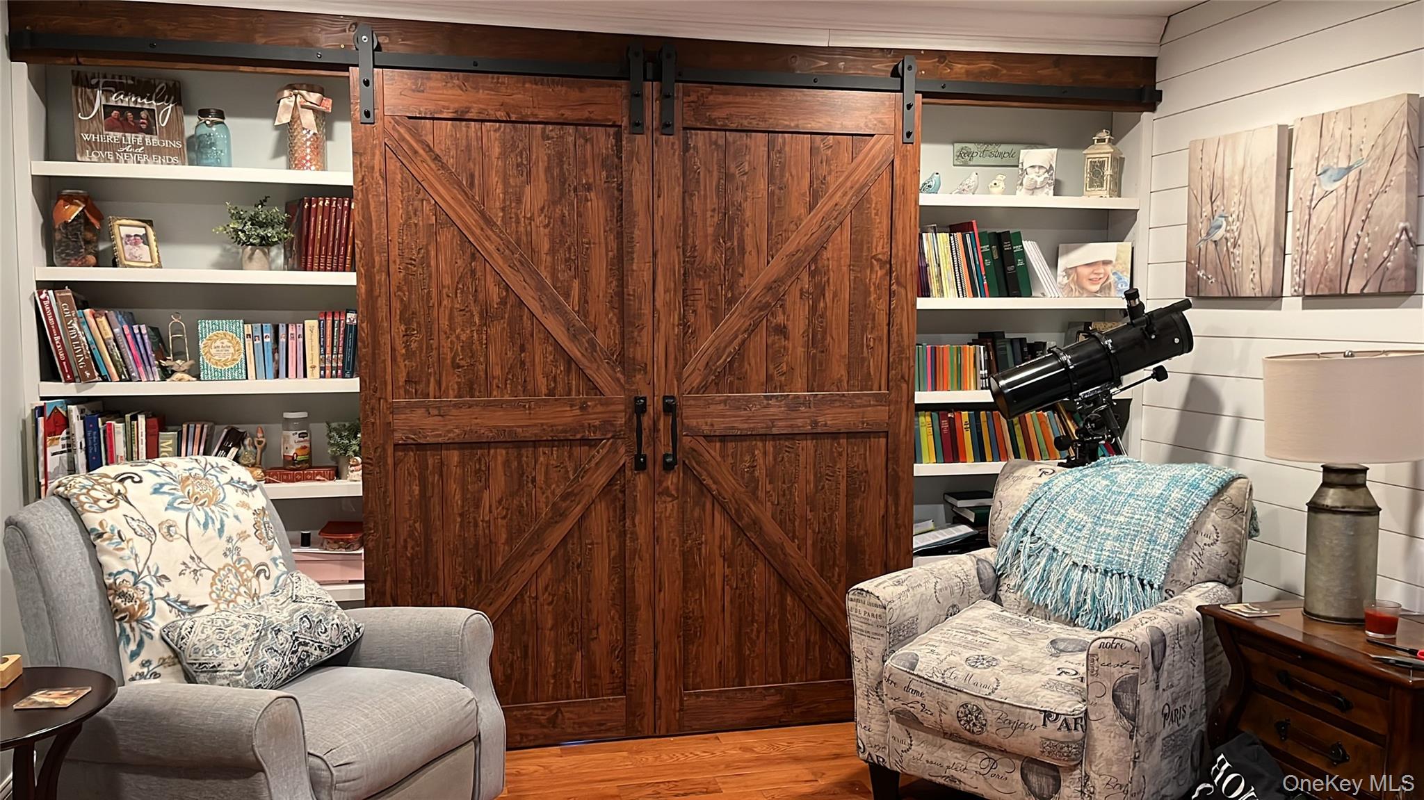 124 Rutsonville Road Wallkill, NY 12589 - Photo 26 of 33 Custom Built in book shelves with Barn doors leading to office.