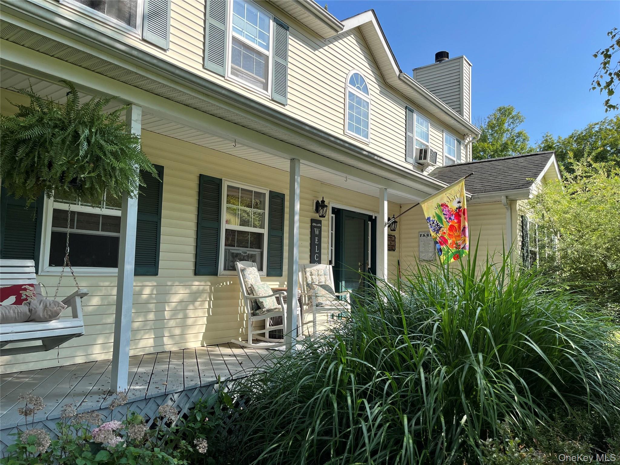 124 Rutsonville Road Wallkill, NY 12589 - Photo 6 of 33 Enjoy the blooming trees while sitting on your front porch.