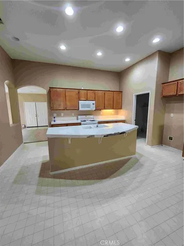 a view of kitchen with granite countertop