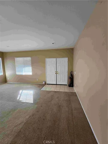 an empty room with a empty space and window