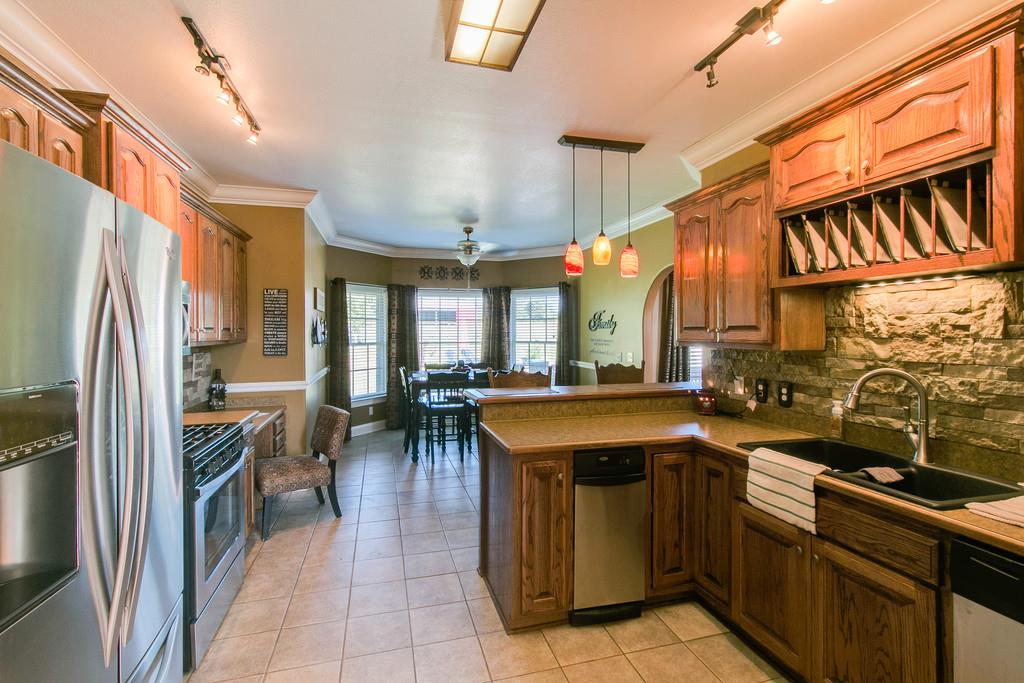 947 Bold Springs Road McEwen, TN 37101 - Photo 7 of 27 Kitchen with stainless appliances Tile flooring open to Breakfast room