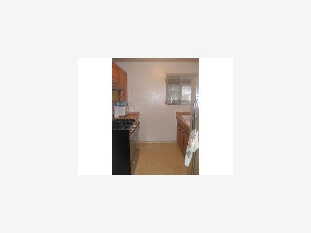 832 Standish Road Pacifica, CA 94044 - Photo 6 of 9 a hallway with table and chairs