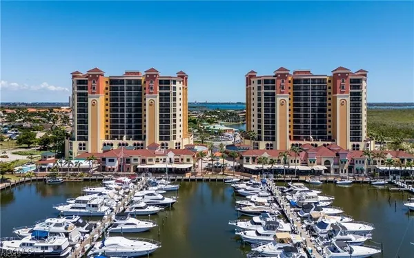 a view of ocean with tall building