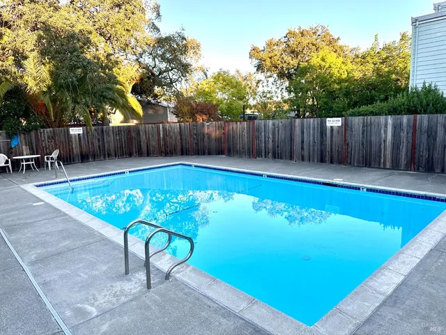 a view of a swimming pool with a patio
