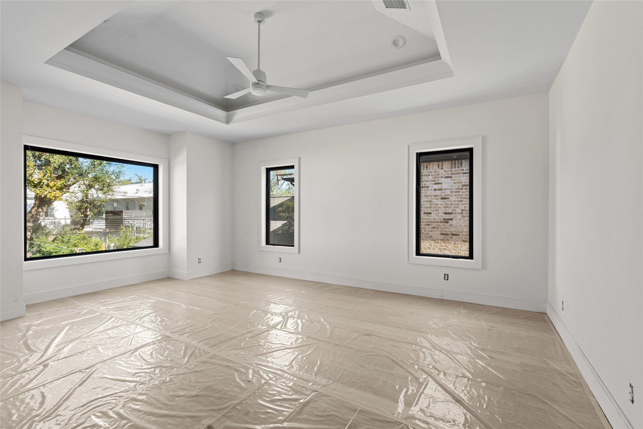 3406 Rice Boulevard Houston, TX 77005 - Photo 7 of 9 wooden floor in an empty room with a window