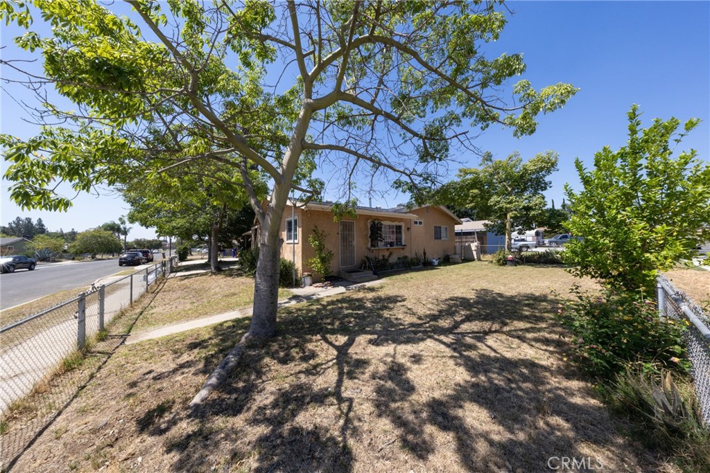 566 South Sage Avenue Rialto, CA 92376 - Photo 3 of 28 a view of street with of trees
