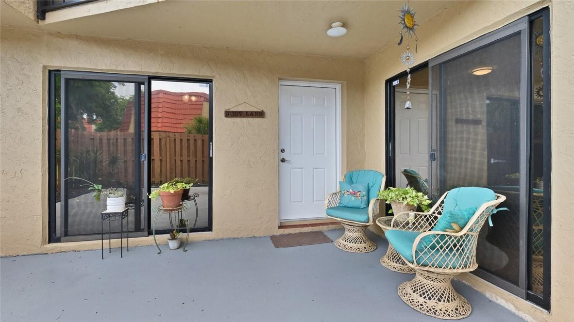 8146 Thames Boulevard, Unit A Boca Raton, FL 33433 - Photo 3 of 18 a room with furniture and a potted plant