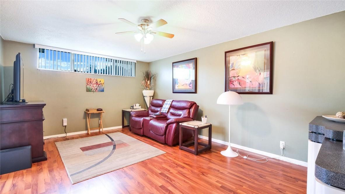 8146 Thames Boulevard, Unit A Boca Raton, FL 33433 - Photo 4 of 18 a living room with furniture and wooden floor