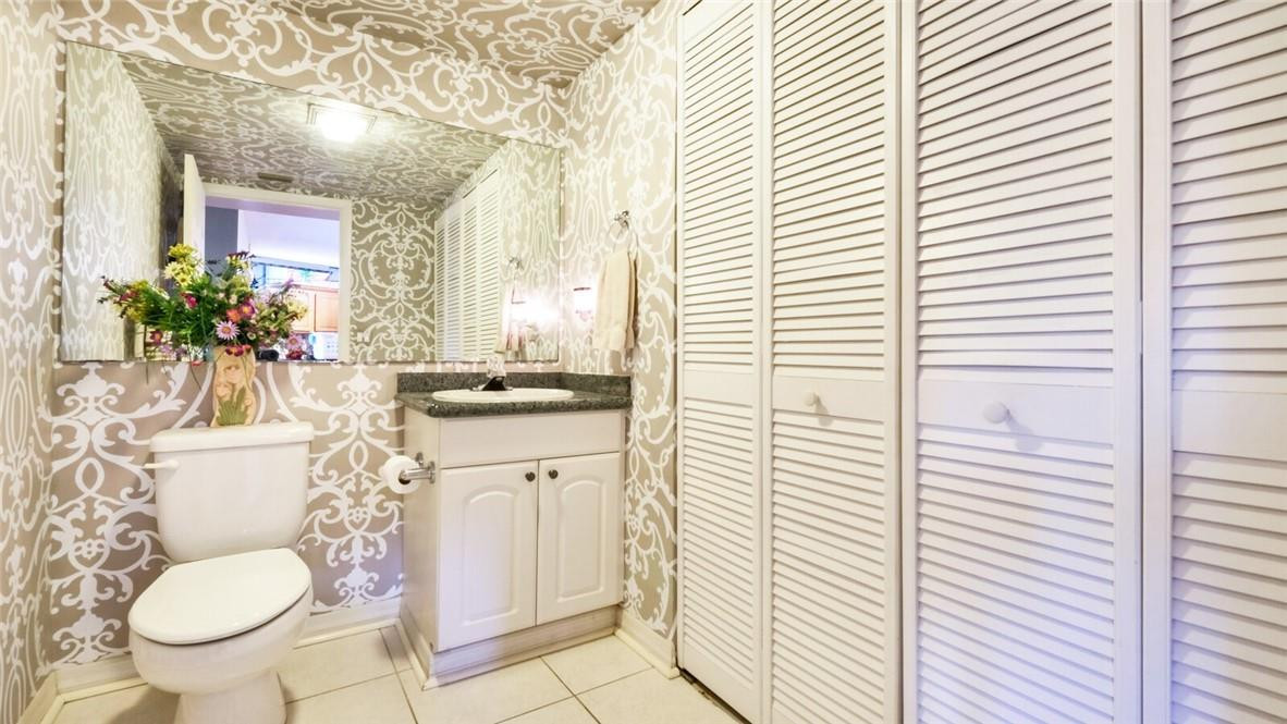 8146 Thames Boulevard, Unit A Boca Raton, FL 33433 - Photo 8 of 18 a bathroom with a sink toilet and shower