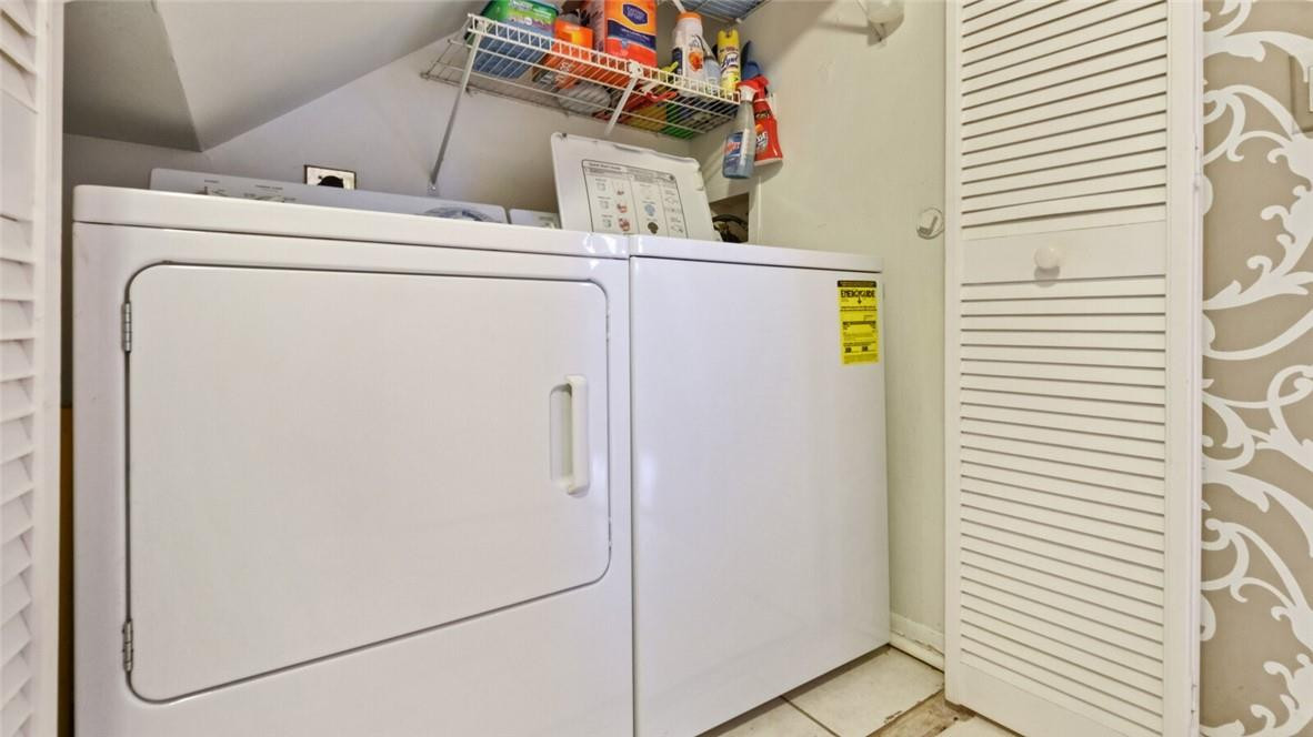 8146 Thames Boulevard, Unit A Boca Raton, FL 33433 - Photo 9 of 18 a utility room with dryer and washer