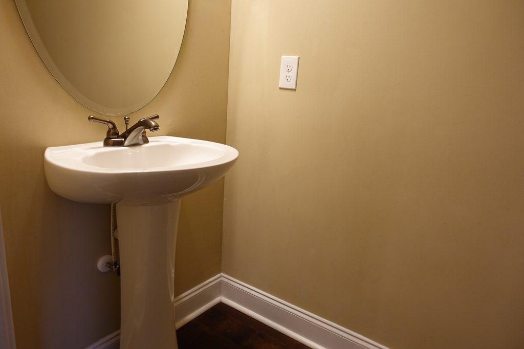9981 Coppice Court Midland, GA 31820 - Photo 14 of 33 a bathroom with a sink and mirror