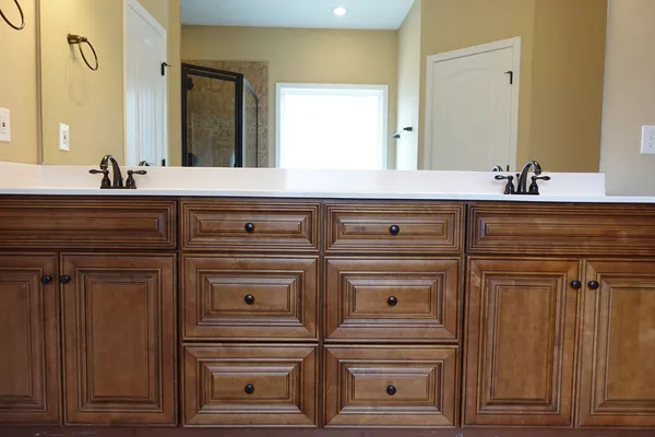 a view of a kitchen cabinets and wooden floor