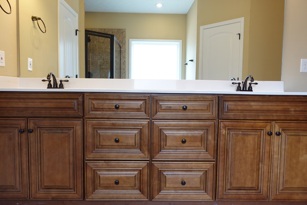 9981 Coppice Court Midland, GA 31820 - Photo 25 of 33 a bathroom with a sink and a mirror
