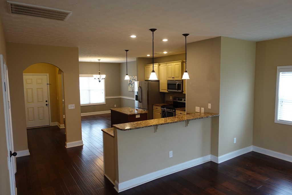 9981 Coppice Court Midland, GA 31820 - Photo 28 of 33 a view of a kitchen cabinets and wooden floor