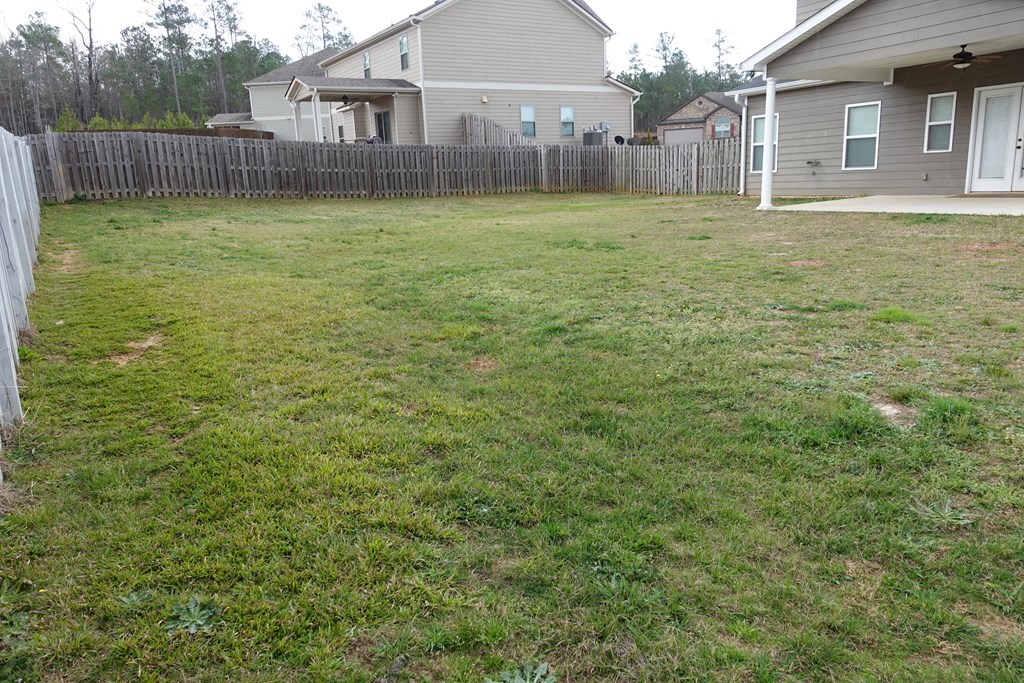 9981 Coppice Court Midland, GA 31820 - Photo 32 of 33 a view of a house with a yard