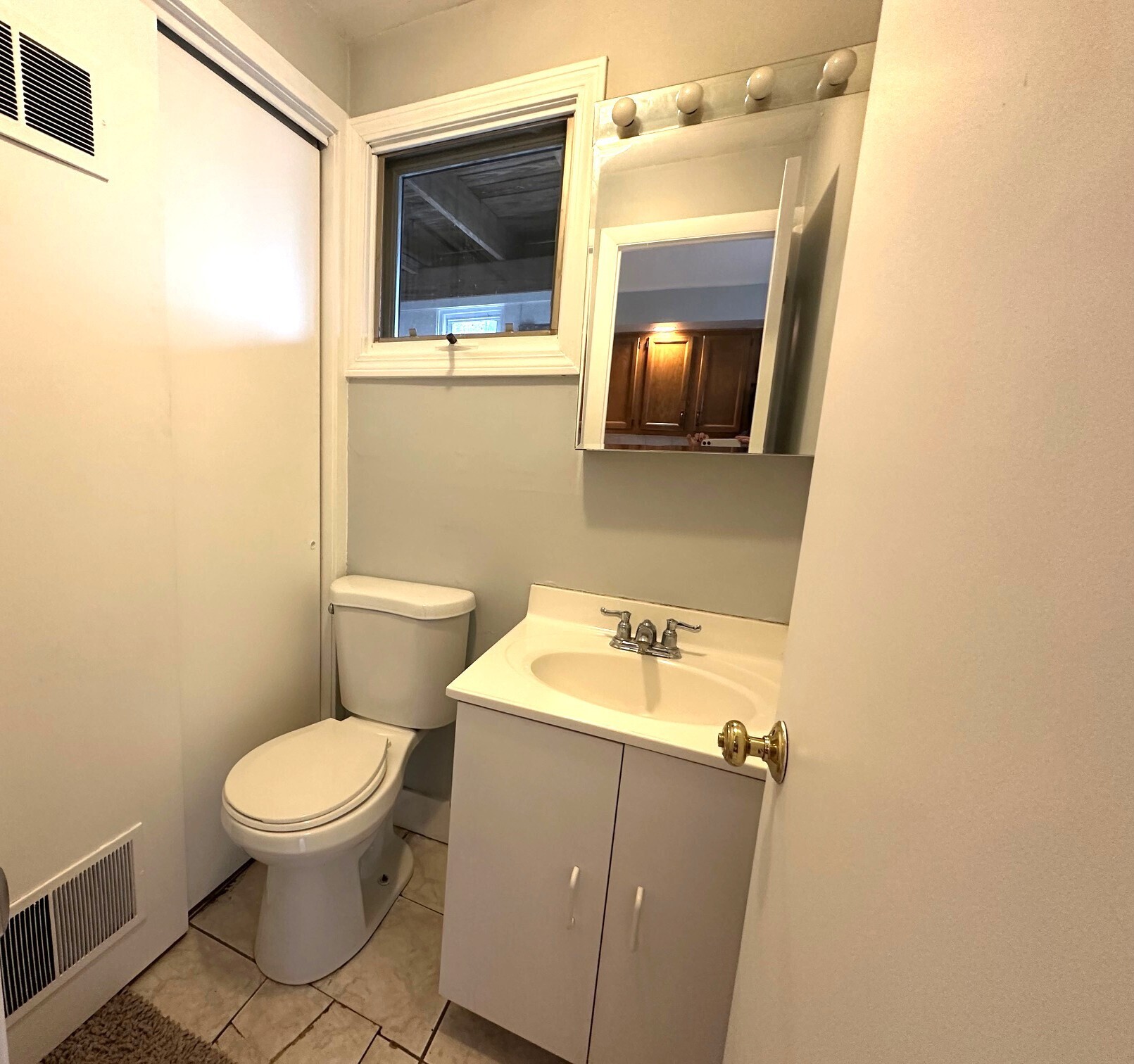 1 Cora Street, Unit 4 New Haven, CT 06512 - Photo 9 of 22 a bathroom with a toilet sink and mirror