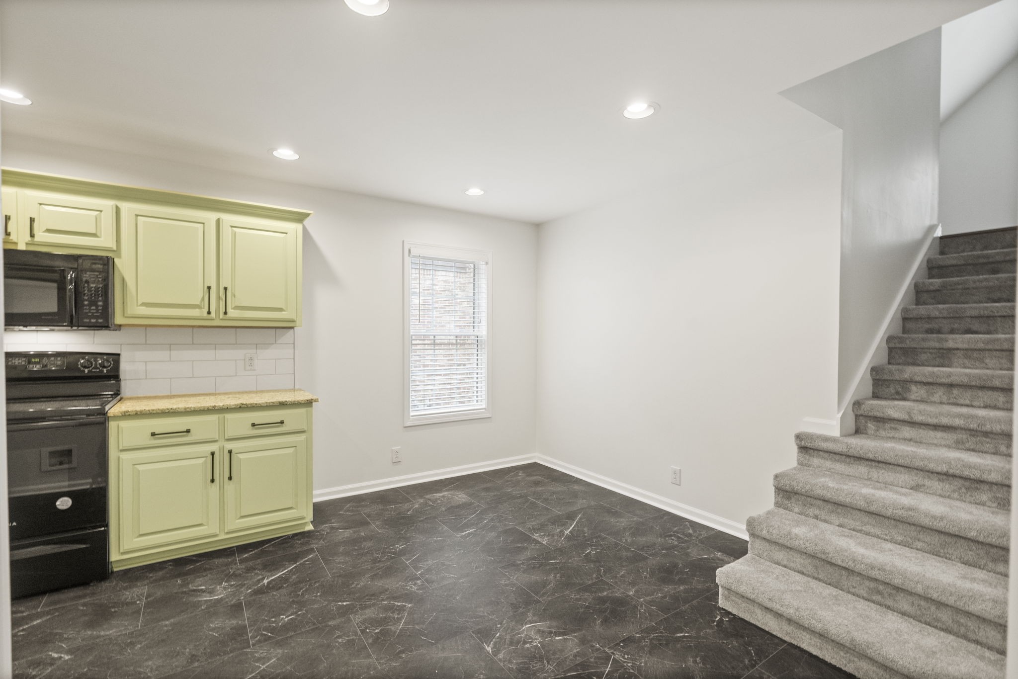 164 Foxrun Springfield, TN 37172 - Photo 12 of 37 a view of a kitchen with a sink cabinets and a window