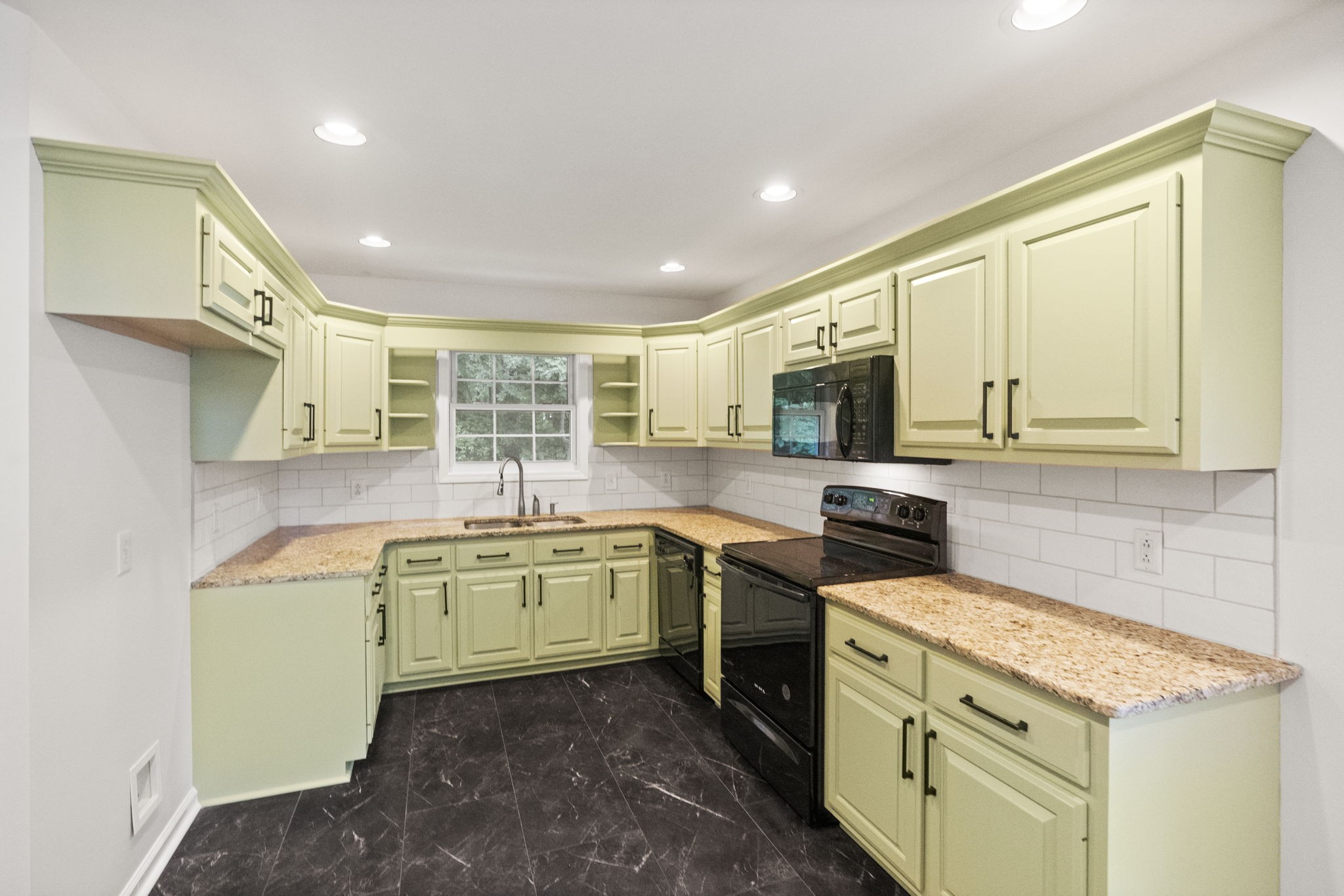 164 Foxrun Springfield, TN 37172 - Photo 15 of 37 a kitchen with a sink stove and microwave