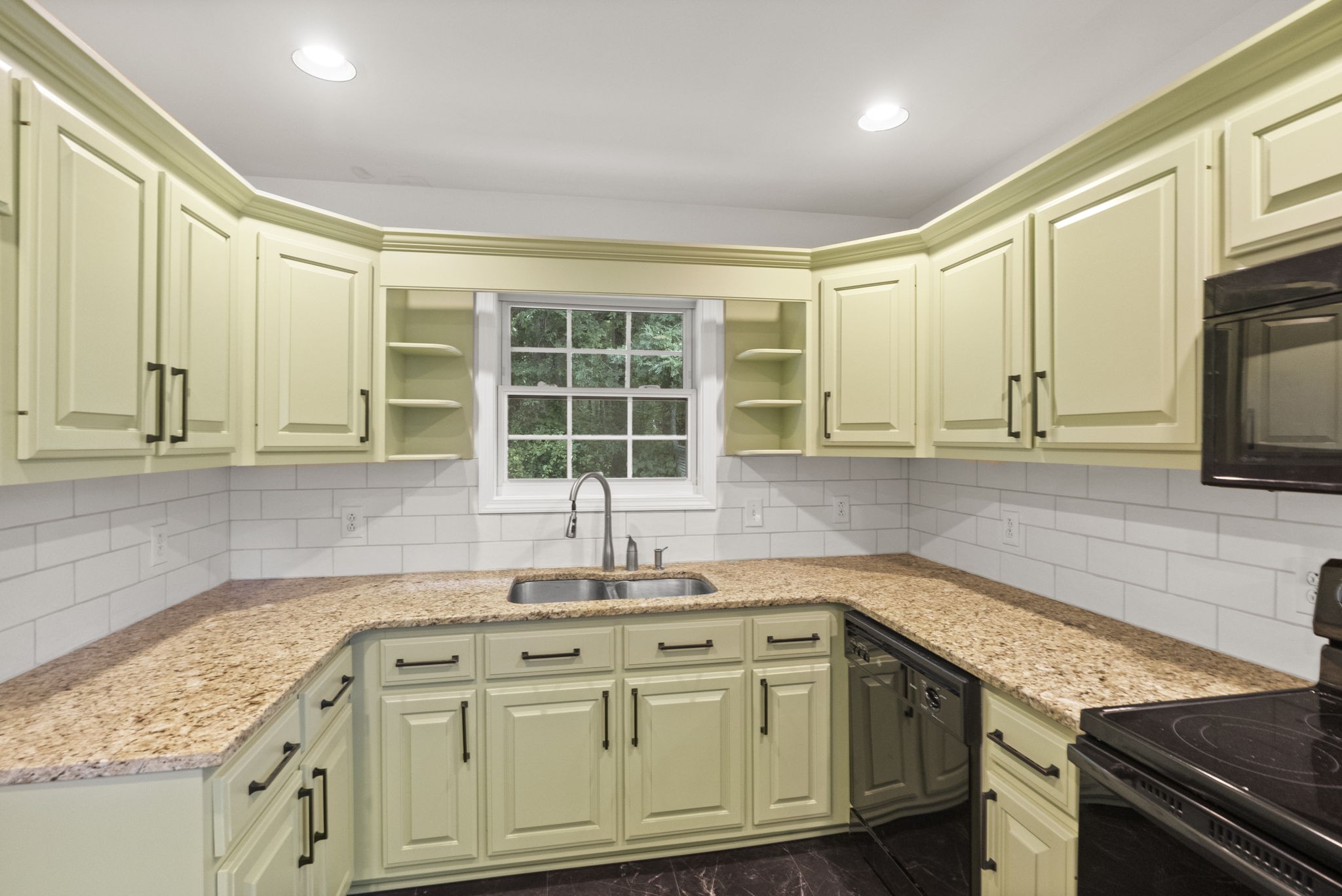 164 Foxrun Springfield, TN 37172 - Photo 17 of 37 a kitchen with granite countertop a sink stainless steel appliances and cabinets
