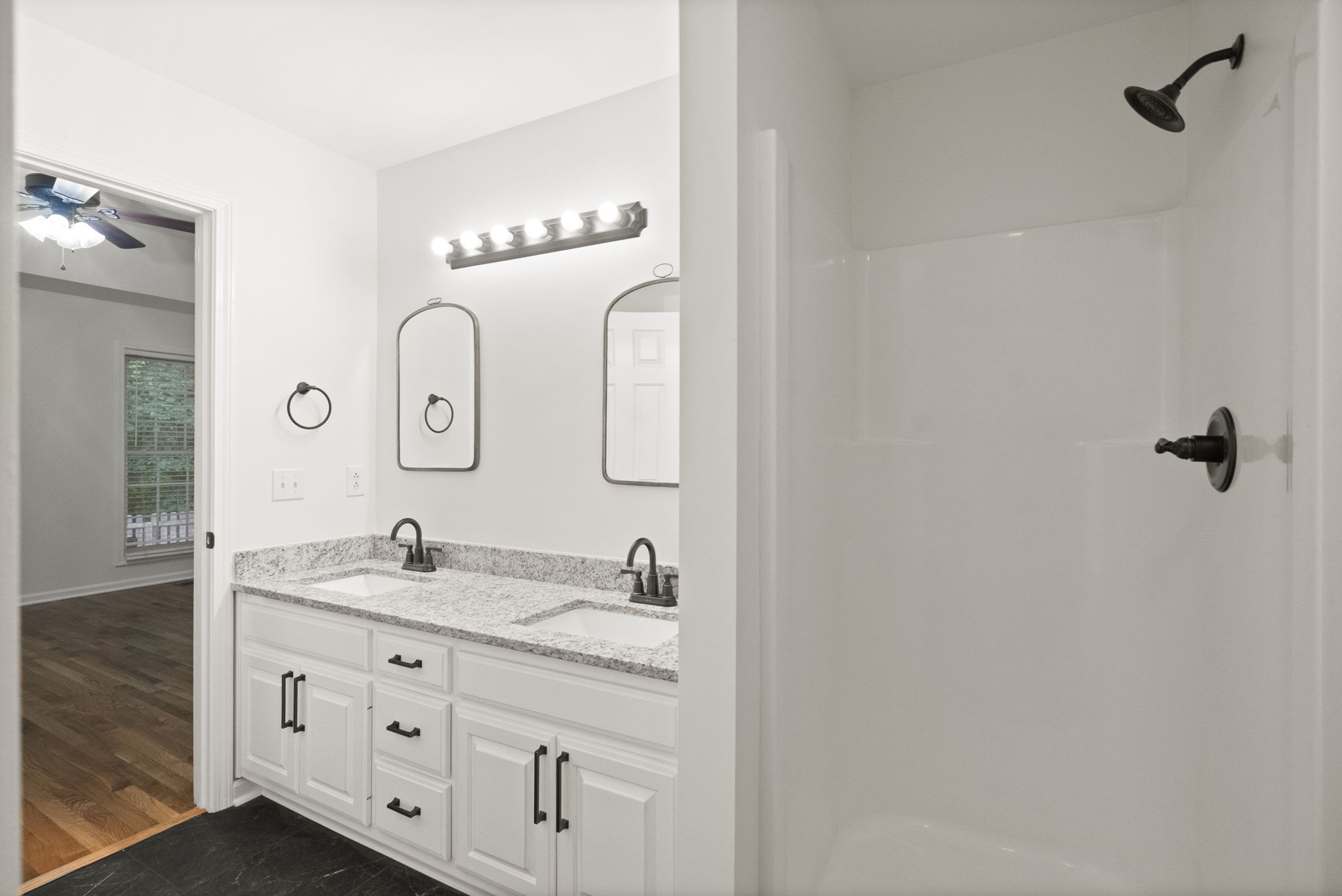 164 Foxrun Springfield, TN 37172 - Photo 25 of 37 a bathroom with a granite countertop sink and a mirror