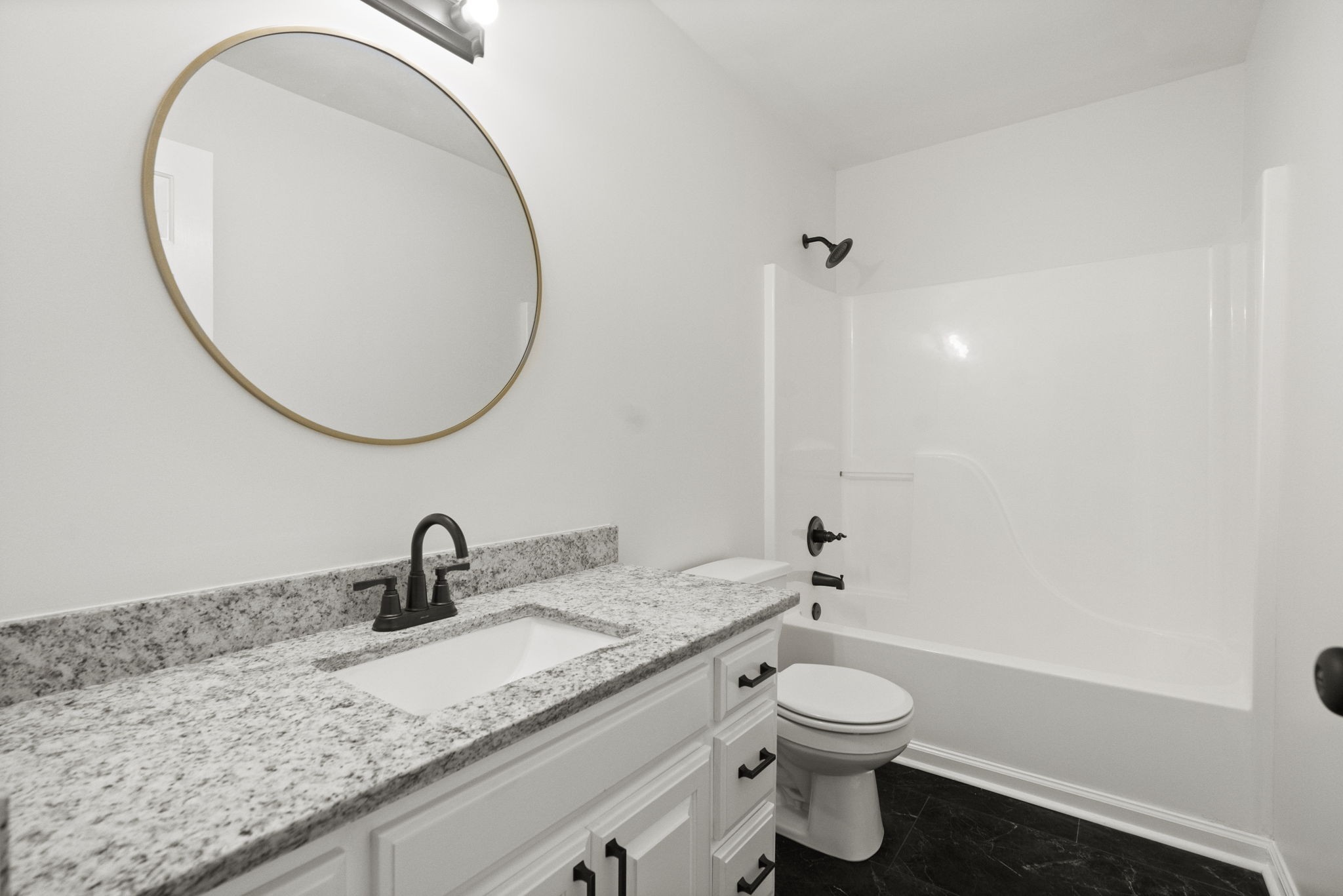 164 Foxrun Springfield, TN 37172 - Photo 29 of 37 a bathroom with a granite countertop sink a toilet and a mirror