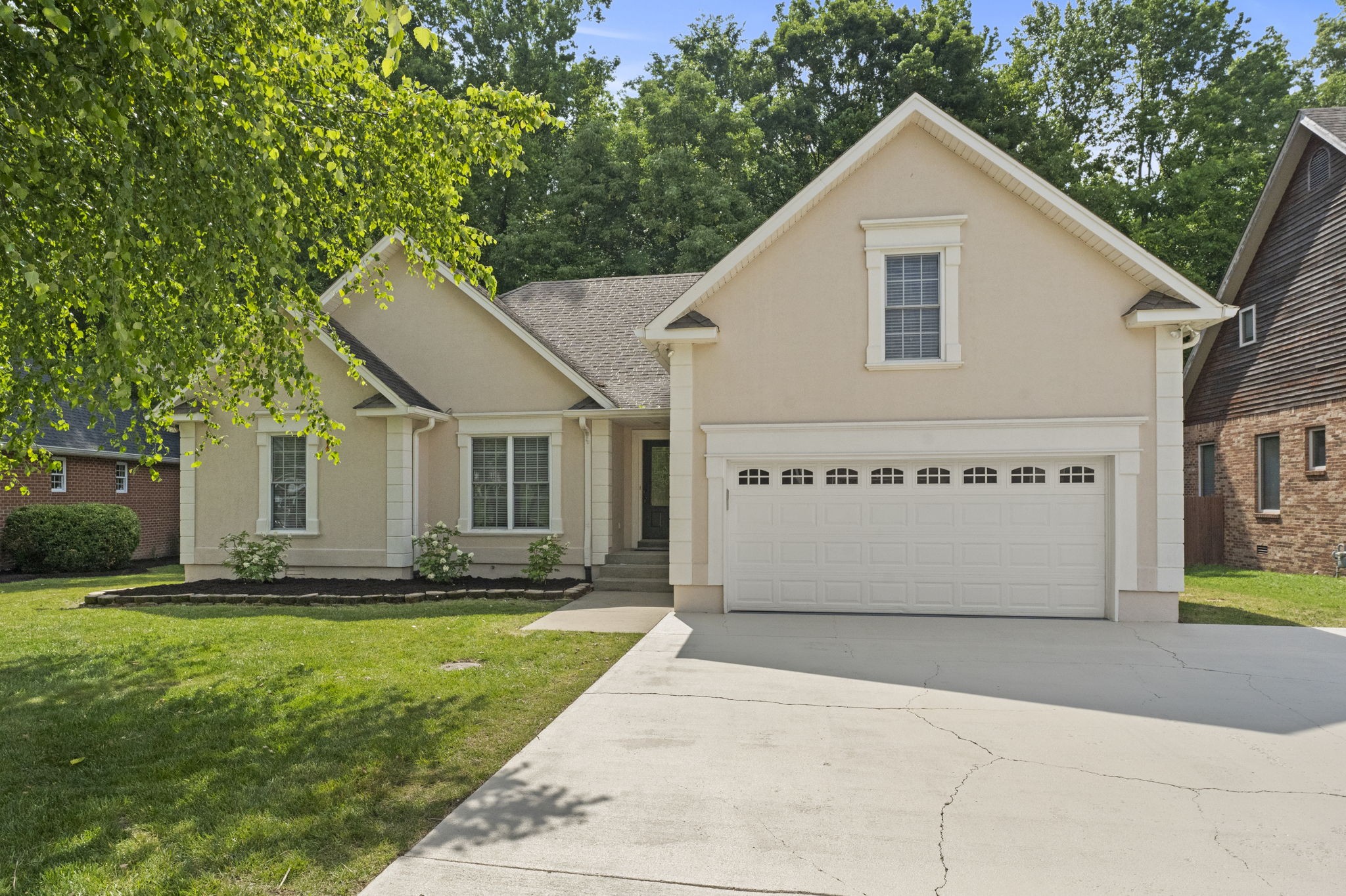 164 Foxrun Springfield, TN 37172 - Photo 3 of 37 a view of a white house with a big yard and large tree