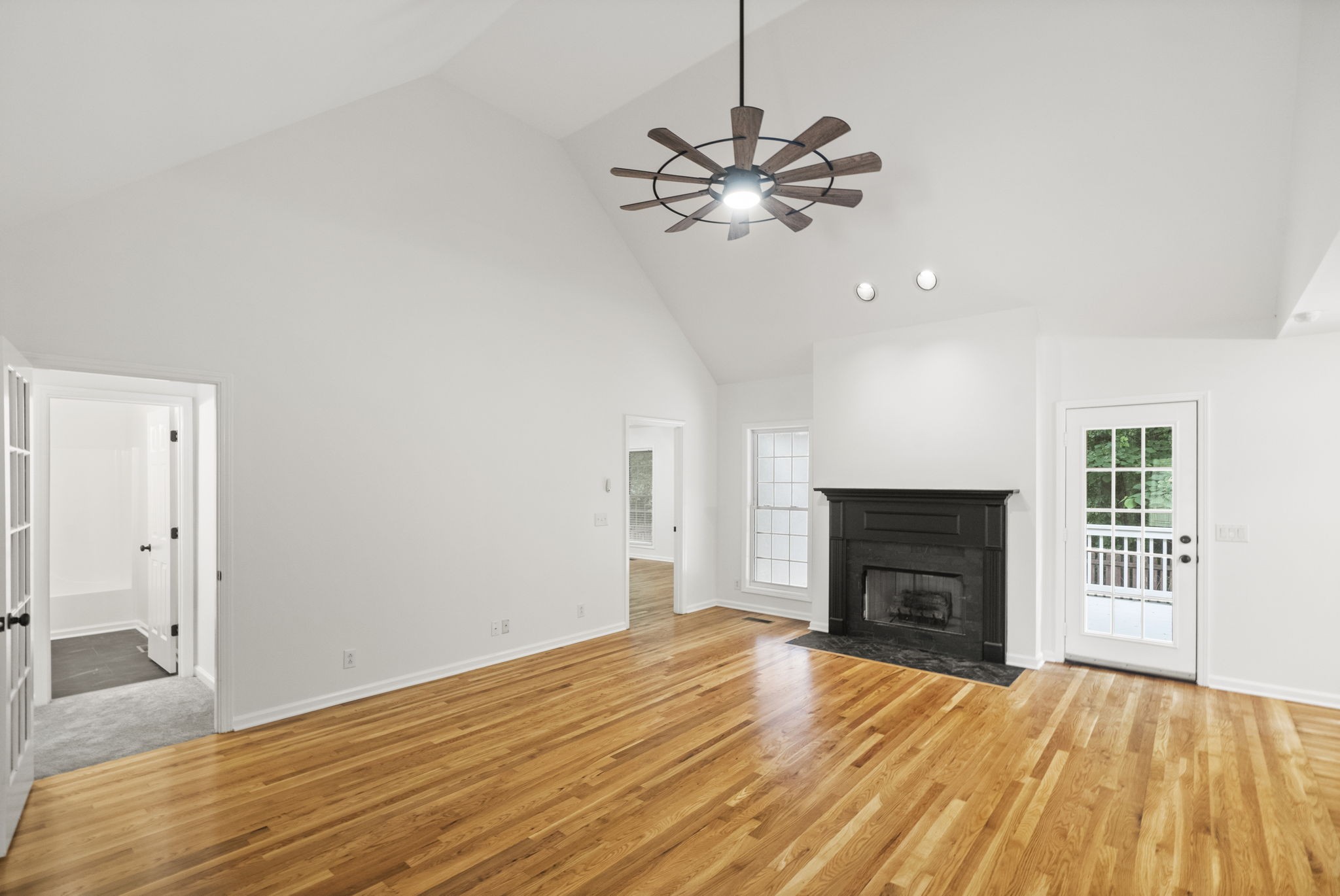 164 Foxrun Springfield, TN 37172 - Photo 7 of 37 a view of empty room with wooden floor and fireplace