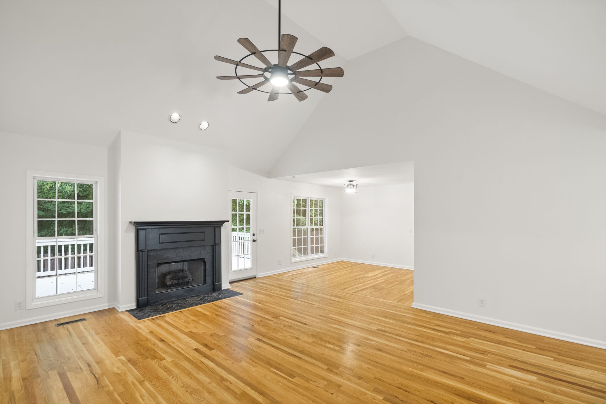 164 Foxrun Springfield, TN 37172 - Photo 8 of 37 a view of an empty room with a fireplace and a window