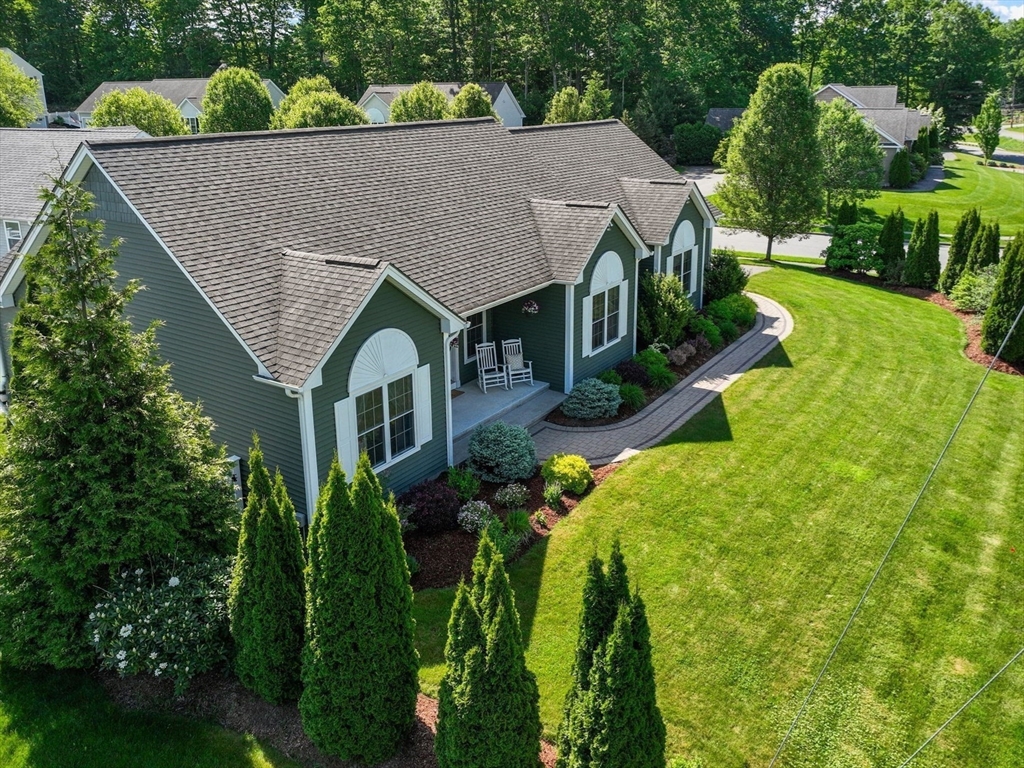 63 Vista Circle Holden, MA 01520 - Photo 1 of 36 a aerial view of a house with a yard and potted plants