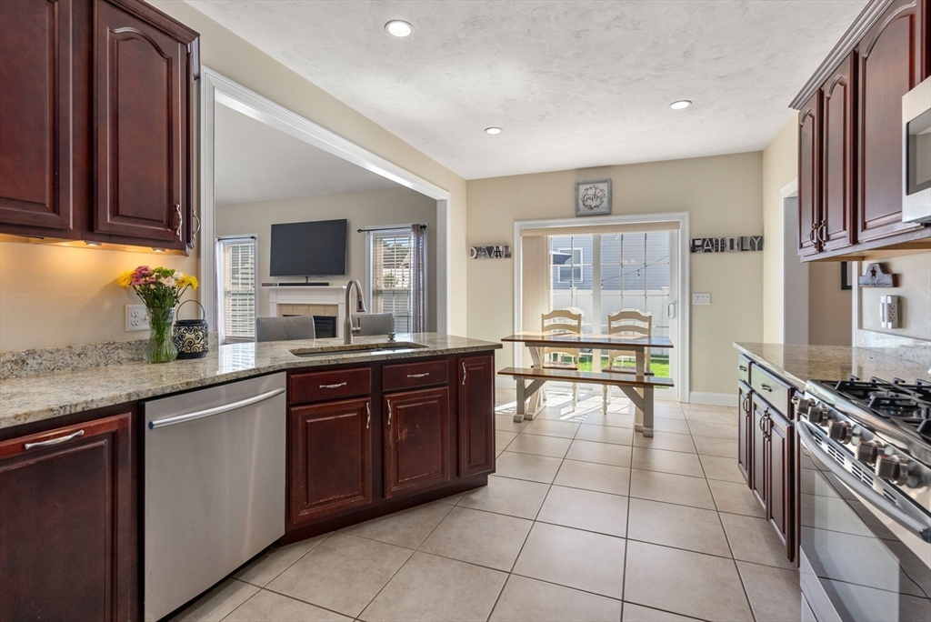 63 Vista Circle Holden, MA 01520 - Photo 13 of 36 a kitchen with a sink appliances and cabinets