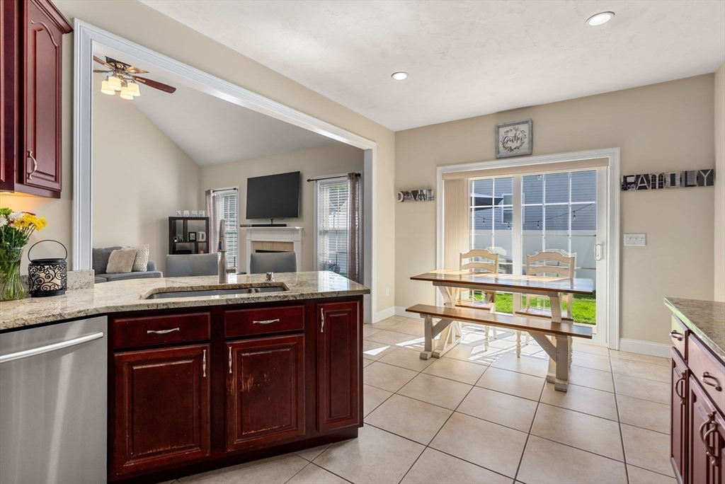 63 Vista Circle Holden, MA 01520 - Photo 15 of 36 a spacious bathroom with a granite countertop sink a mirror and a bathtub