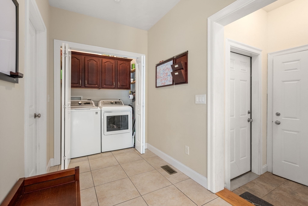 63 Vista Circle Holden, MA 01520 - Photo 19 of 36 a kitchen with white cabinets and white appliances