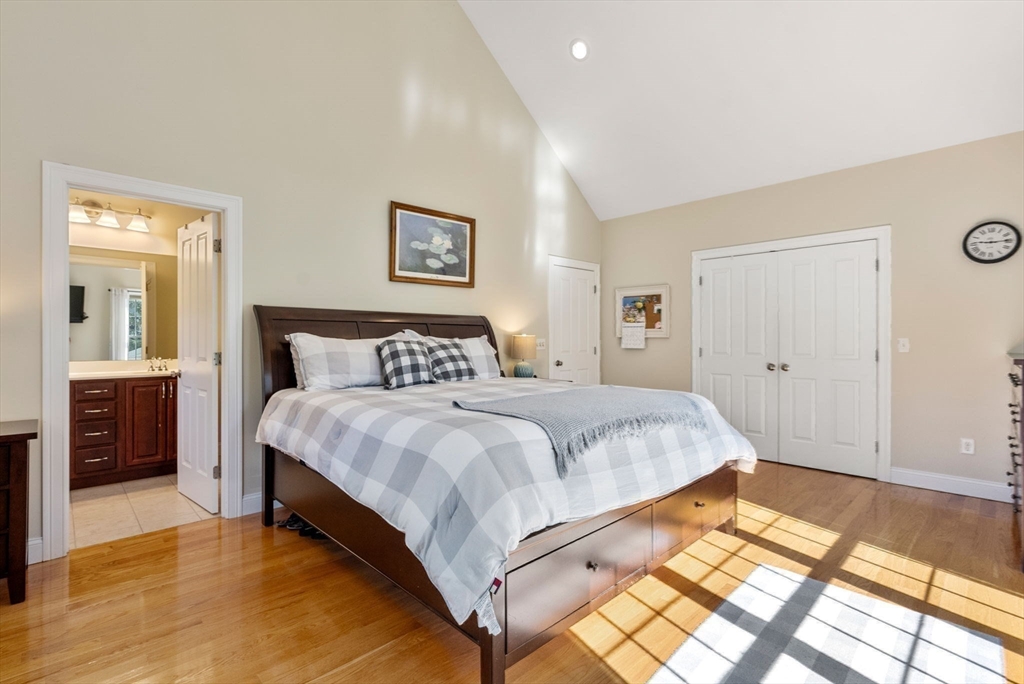 63 Vista Circle Holden, MA 01520 - Photo 20 of 36 a bedroom with a bed and a painting on the wall